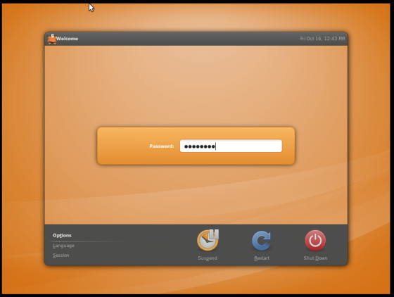 The login screen has the familiar orange coloring of the desktop.